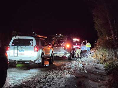 Vehicles at night responding to a search and rescue mission